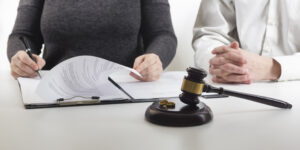 Legal Separation-couple signing papers
